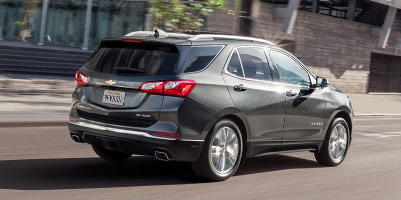 Rear angle view of 2020 Chevrolet Equinox driving