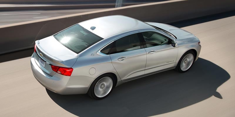 Top down view of a silver 2020 Chevrolet Impala driving
