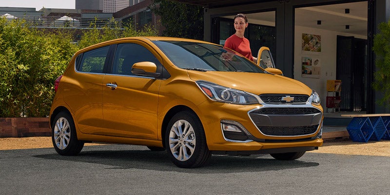 2020 Chevrolet Spark parked with woman getting into driver's seat