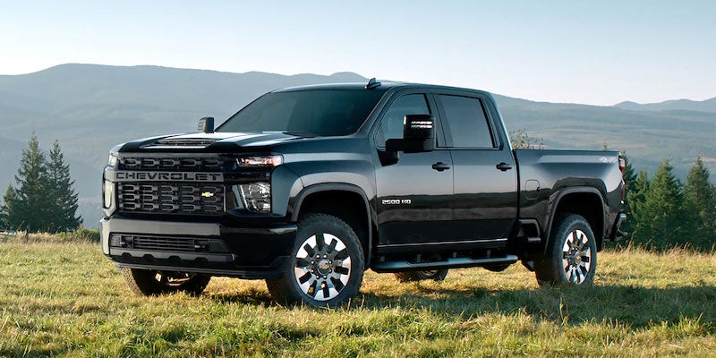 Black 2021 Chevrolet Silverado 2500 HD parked on grass