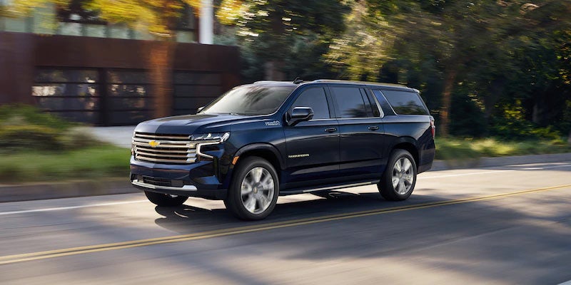 Black 2021 Chevrolet Suburban driving on roadway