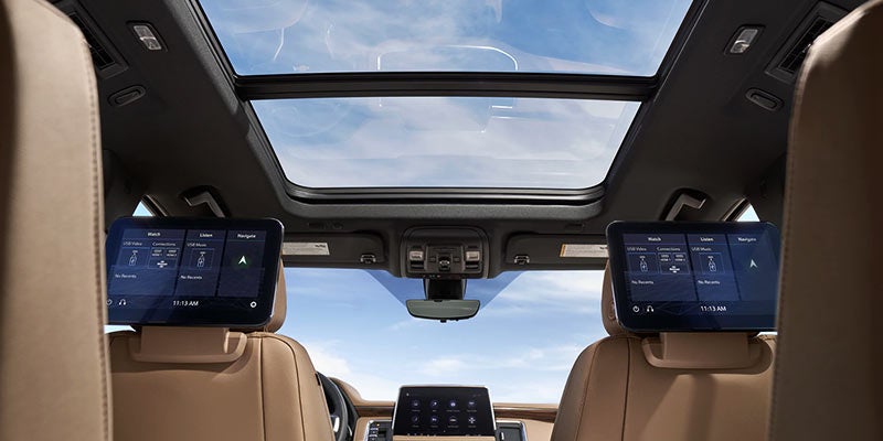 Interior view looking up through moon roof in a 2021 Chevrolet Suburban
