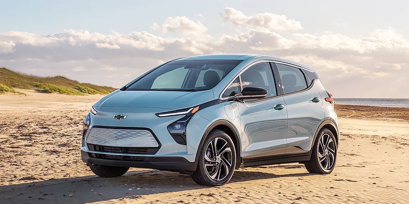 2022 Chevy Bolt EV parked on sand at beach