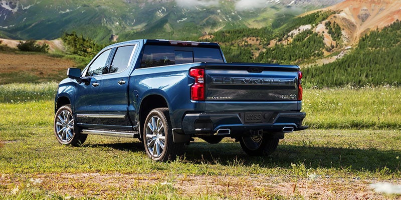 Rear angle view of a blue 2022 Chevrolet Silverado 1500