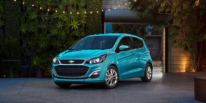 front angle view of a blue 2022 Chevy Spark