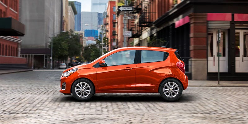 side view of an orange 2022 Chevrolet Spark