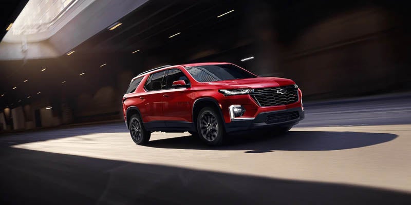 red 2022 Chevrolet Traverse driving on road