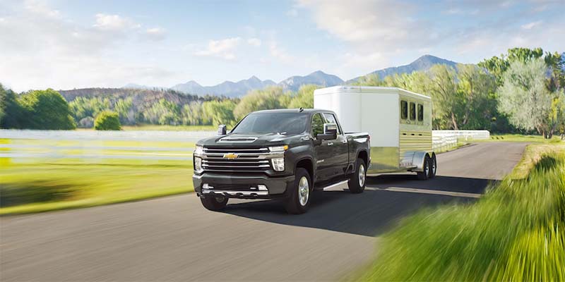 2023 ChevroletSilverado HD driving and towing trailer