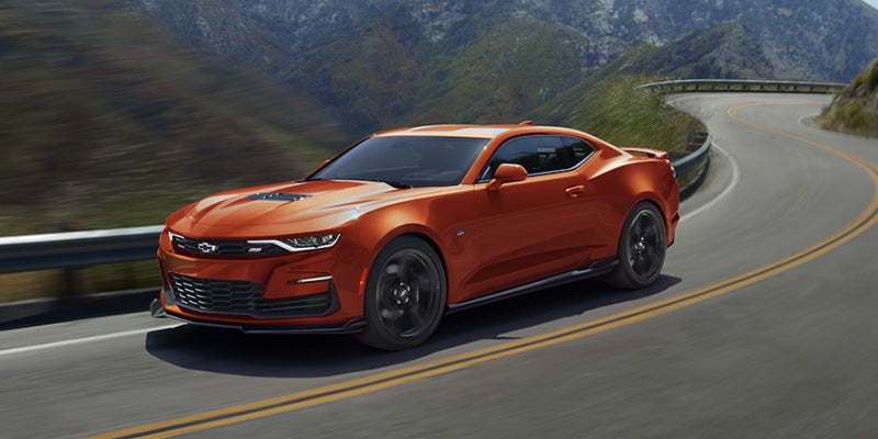 Orange 2024 Chevrolet Camaro driving on road