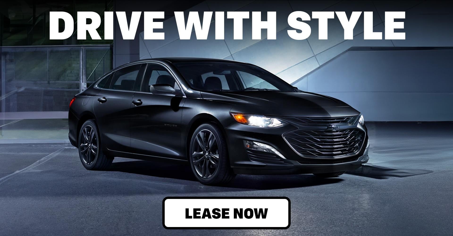 Black Chevy Malibu in a parking lot