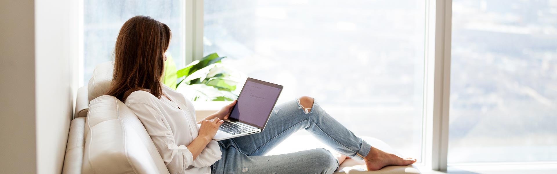 Woman shopping online with a laptop